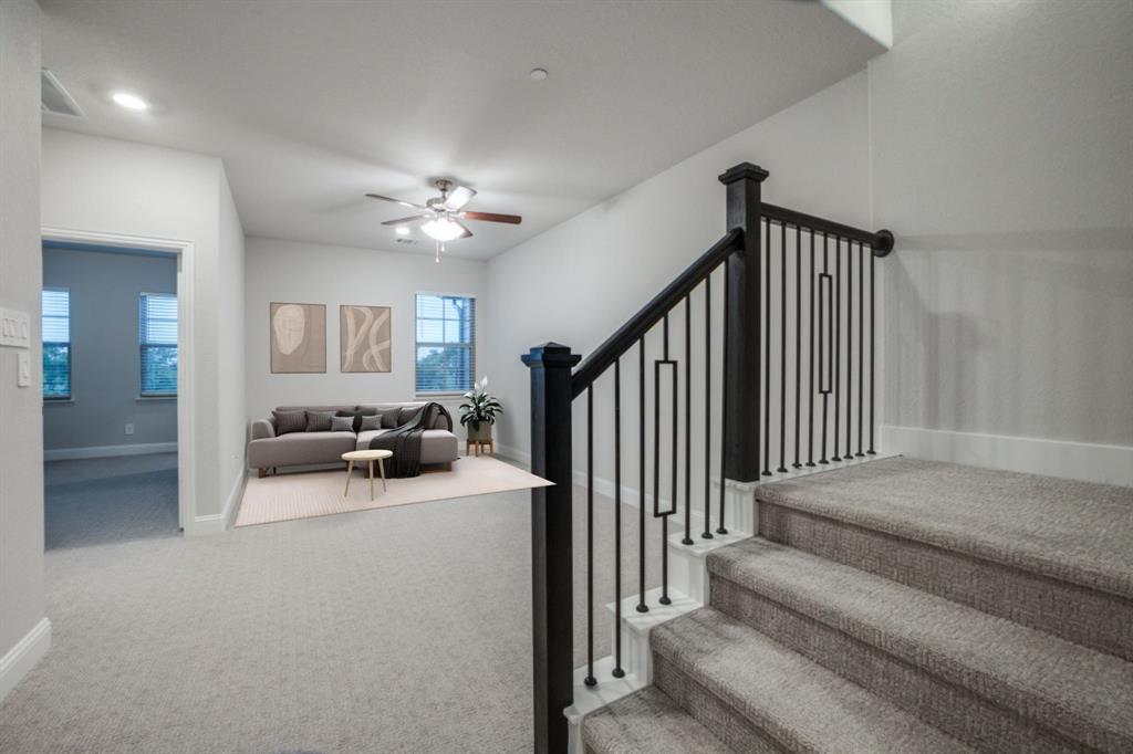 7833 Sunset Boulevard Rowlett, TX 75088 - Photo 10 of 20 a view of a livingroom with furniture and staircase