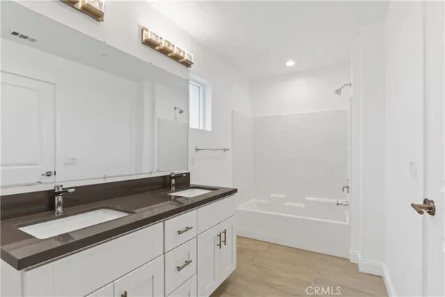 a bathroom with a sink and a bathtub