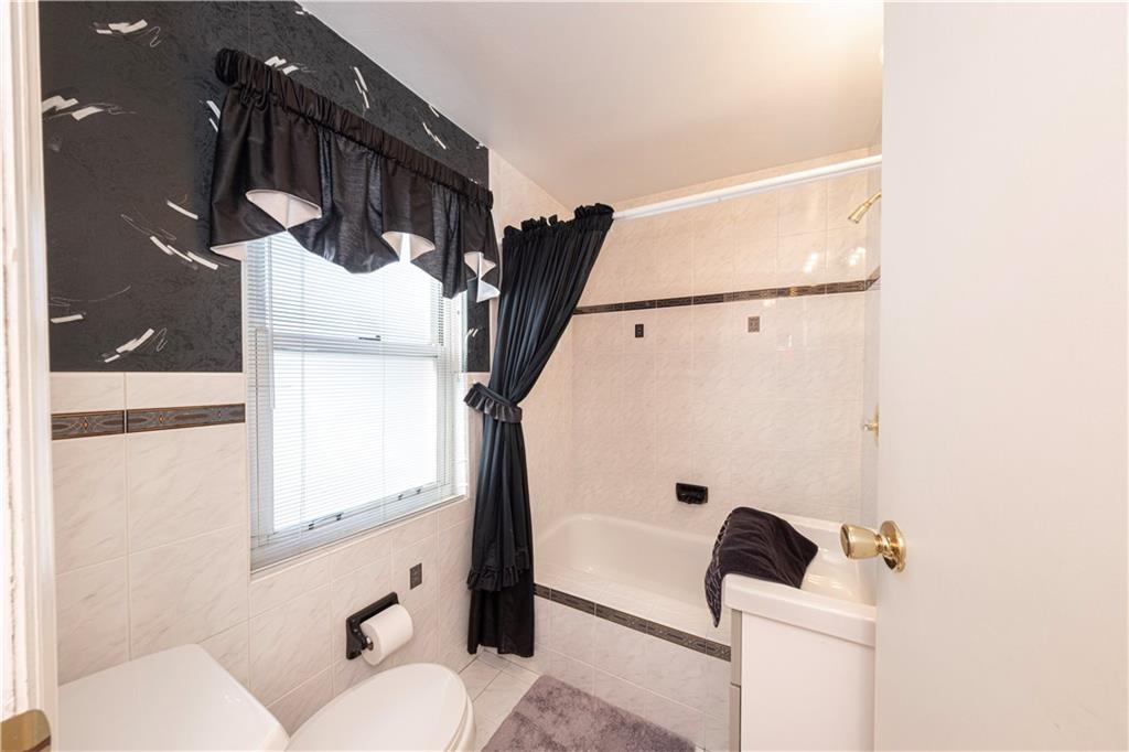 2511 McNeilly Road Pittsburgh, PA 15226 - Photo 14 of 23 a bathroom with a toilet sink and mirror