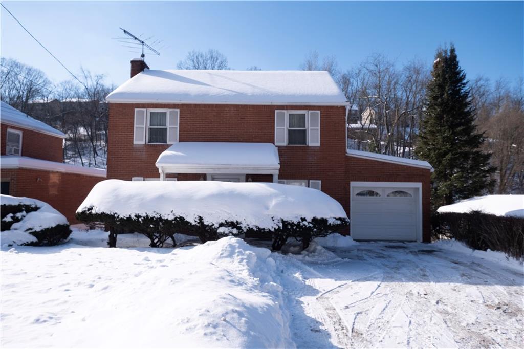 2511 McNeilly Road Pittsburgh, PA 15226 - Photo 2 of 23 a front view of a house with a yard