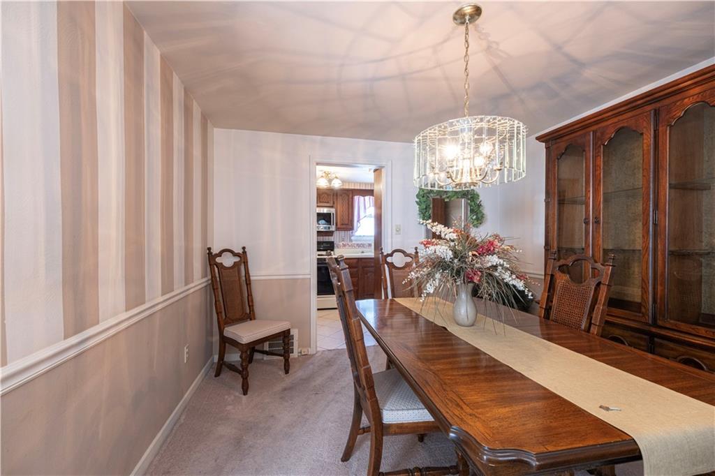 2511 McNeilly Road Pittsburgh, PA 15226 - Photo 6 of 23 a view of a dining room with furniture and a chandelier