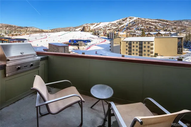 a view of a chairs and table in a terrace