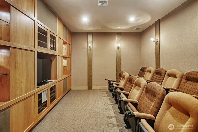 a view of a work space with furniture and wooden floor