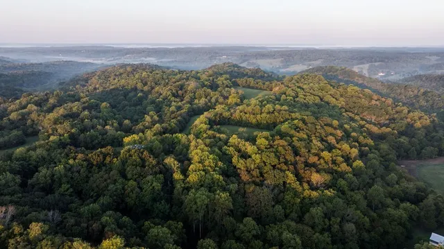 a view of a room that has a window and a kitchen sink