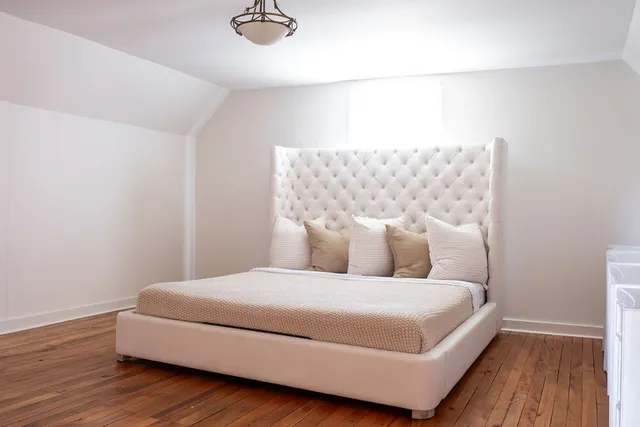 a backyard of a house with yard and trampoline