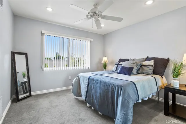 a bed room with a bed and a window