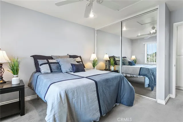 a bedroom with a bed and a couch