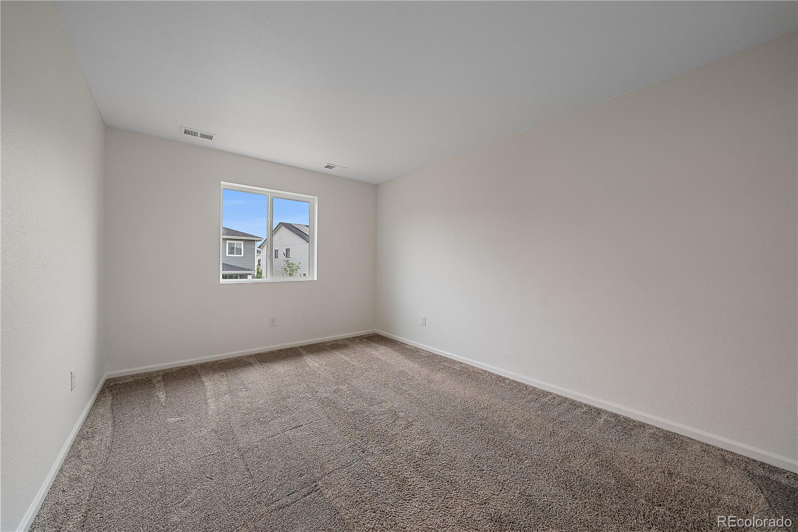 5465 Gray Wolf Lane Castle Rock, CO 80104 - Photo 13 of 21 an empty room with windows