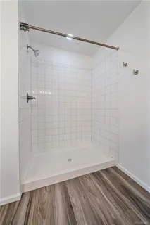 an empty room with a empty space and windows