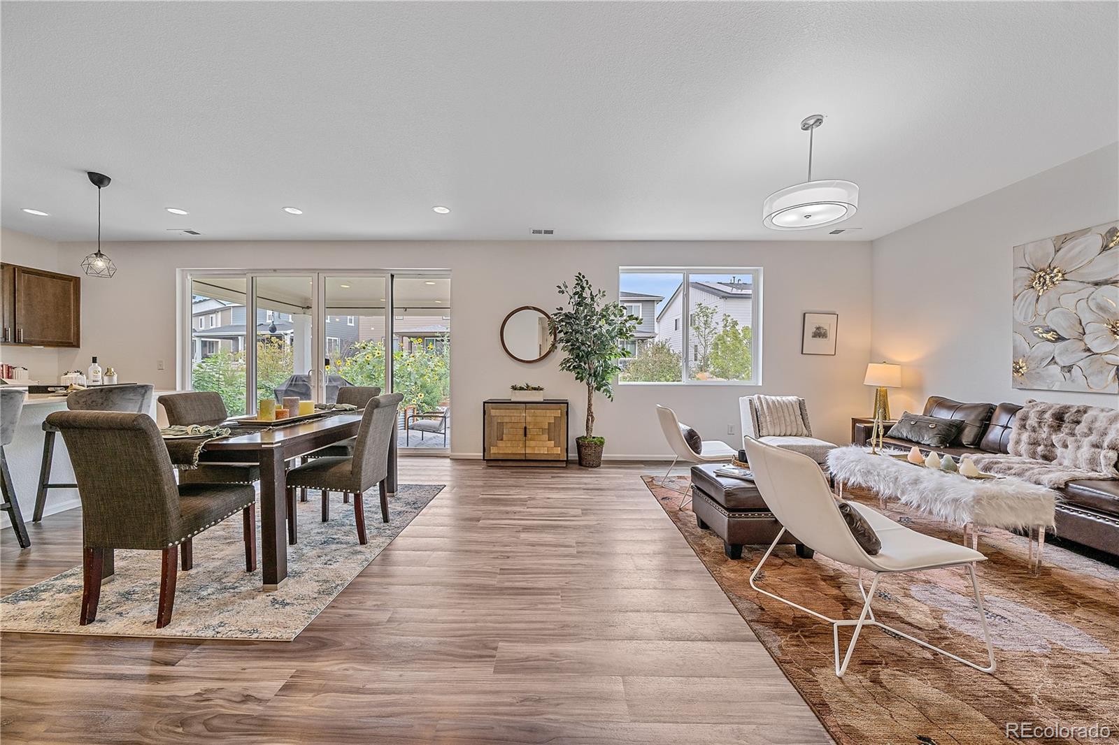 5465 Gray Wolf Lane Castle Rock, CO 80104 - Photo 6 of 21 a living room with furniture dining table and a large window
