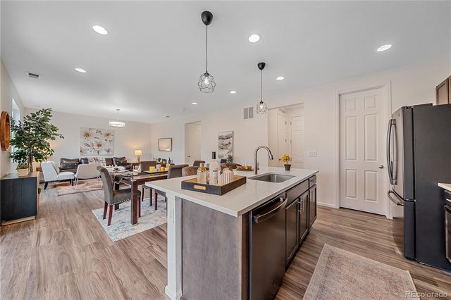 a view of a kitchen and dining room