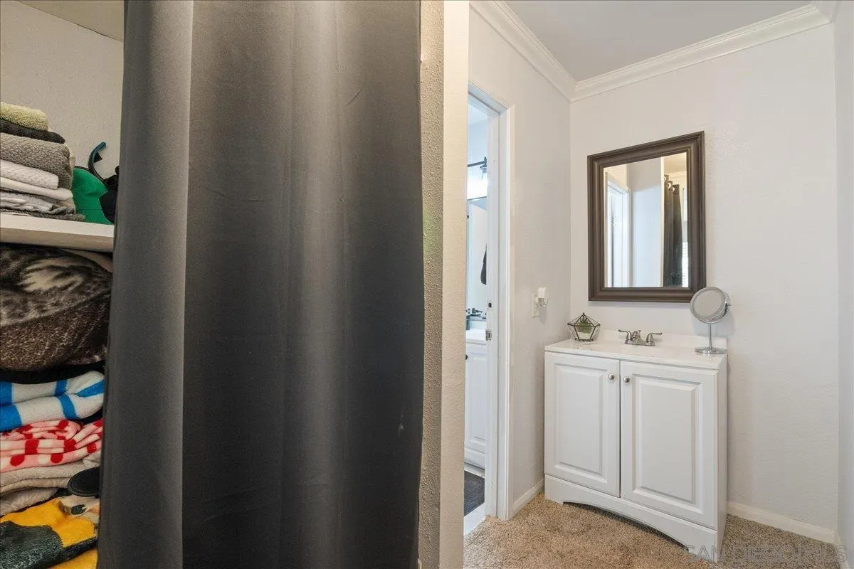 3579 Ruffin Road, Unit 105 San Diego, CA 92123 - Photo 12 of 23 a bathroom with a sink and a mirror