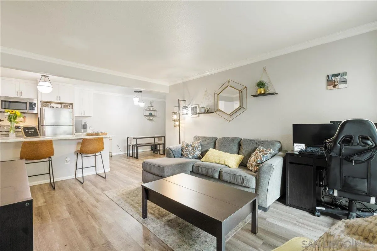 3579 Ruffin Road, Unit 105 San Diego, CA 92123 - Photo 5 of 23 a living room with furniture and wooden floor