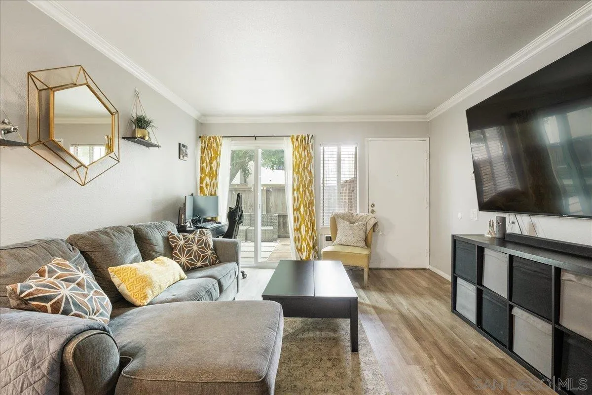 3579 Ruffin Road, Unit 105 San Diego, CA 92123 - Photo 6 of 23 a living room with furniture and a flat screen tv