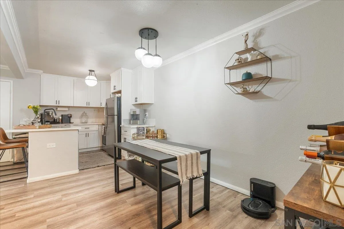 3579 Ruffin Road, Unit 105 San Diego, CA 92123 - Photo 8 of 23 a kitchen with a table and chairs in it