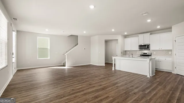 a bathroom with a sink a mirror and a window