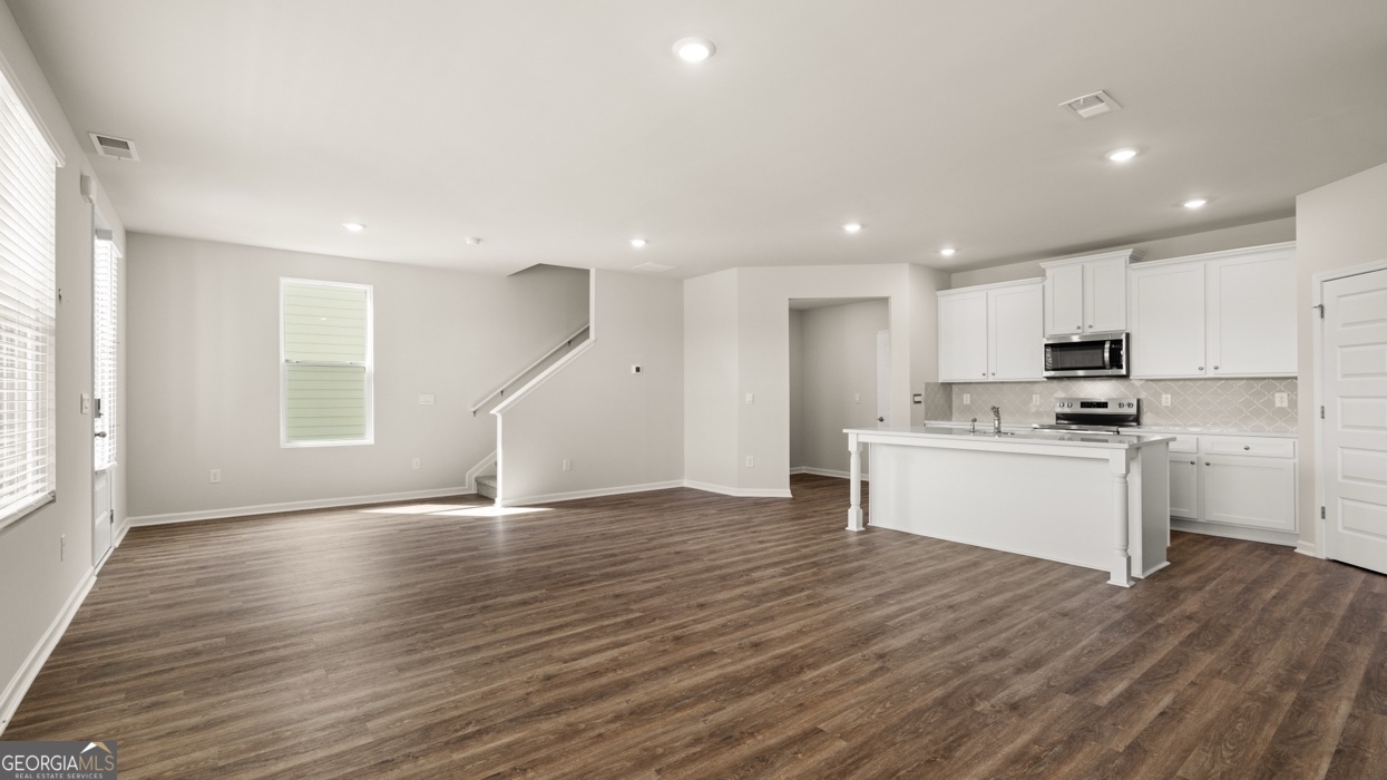 918 Stow Lane Monroe, GA 30655 - Photo 17 of 43 a view of kitchen with wooden floor and electronic appliances