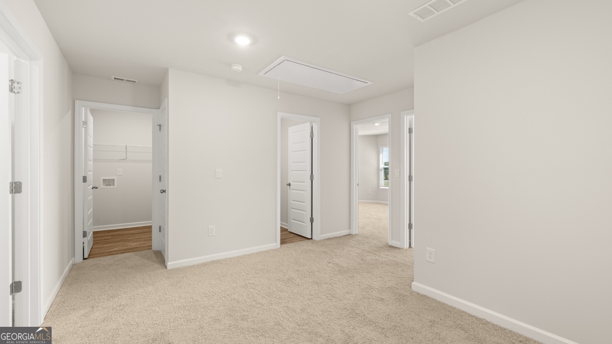 918 Stow Lane Monroe, GA 30655 - Photo 20 of 43 an empty room with closet and a bathroom