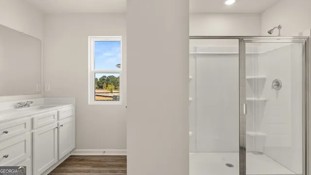 an empty room with closet and a bathroom