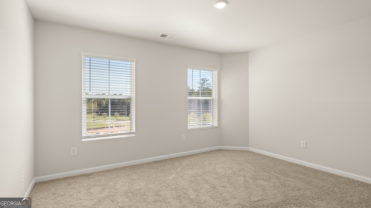918 Stow Lane Monroe, GA 30655 - Photo 32 of 43 an empty room with a window