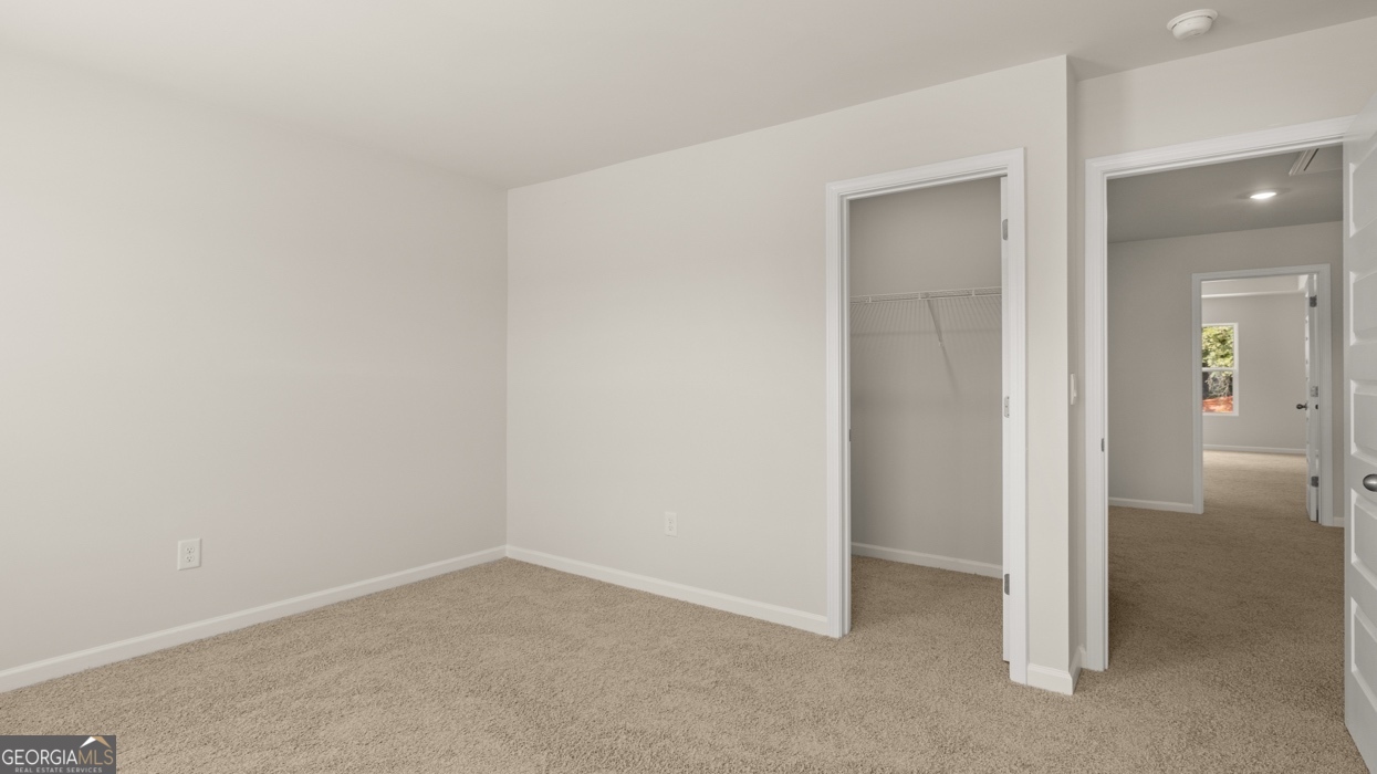 918 Stow Lane Monroe, GA 30655 - Photo 33 of 43 an empty room with closet and a bathroom
