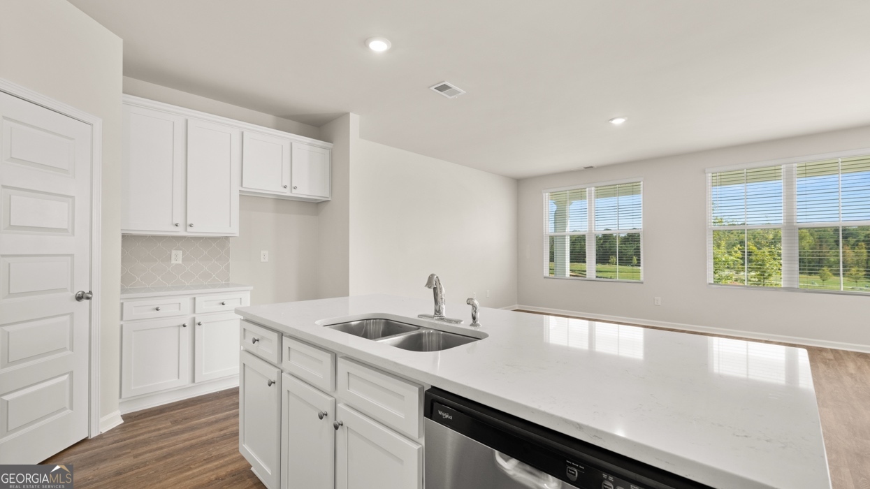 918 Stow Lane Monroe, GA 30655 - Photo 6 of 43 a kitchen with a sink cabinets and window