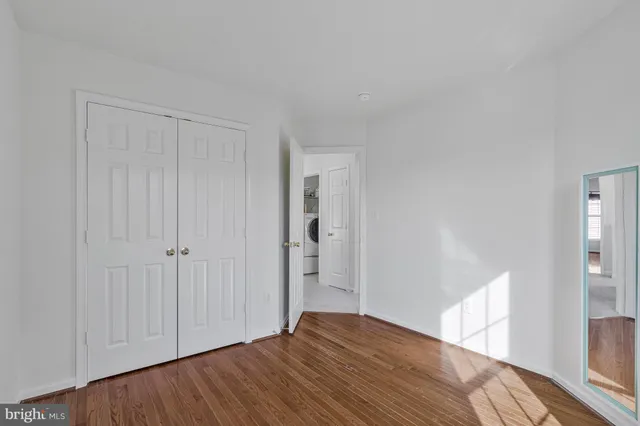 a view of hallway with wooden floor