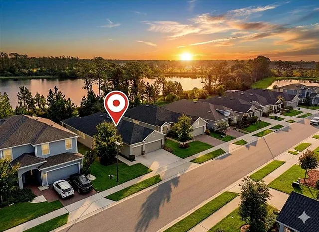 a view of a yard in front view of a house