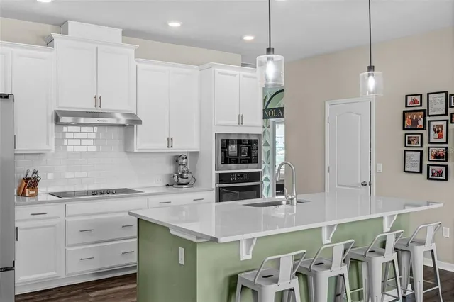 a view of walk in closet with clothes