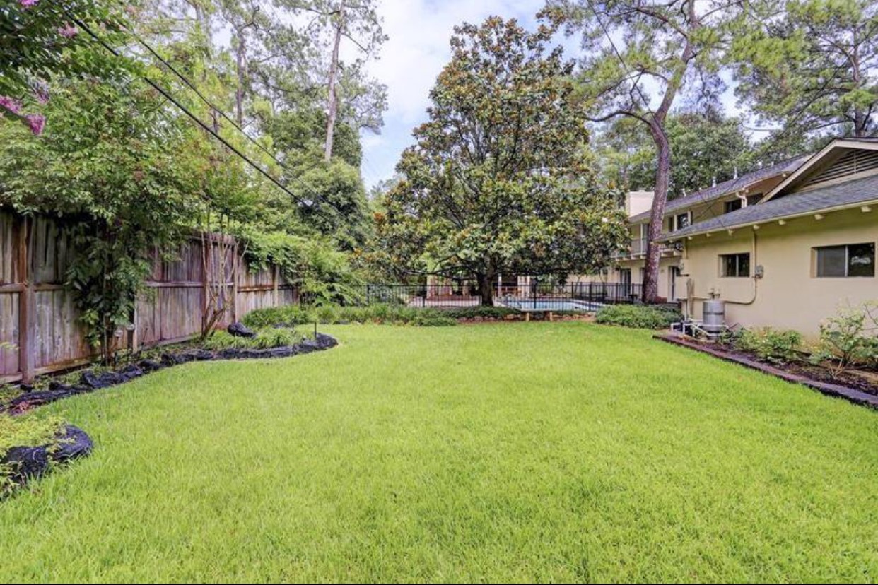 11910 Steppingstone Lane Houston, TX 77024 - Photo 11 of 14 a view of a house with backyard and sitting area