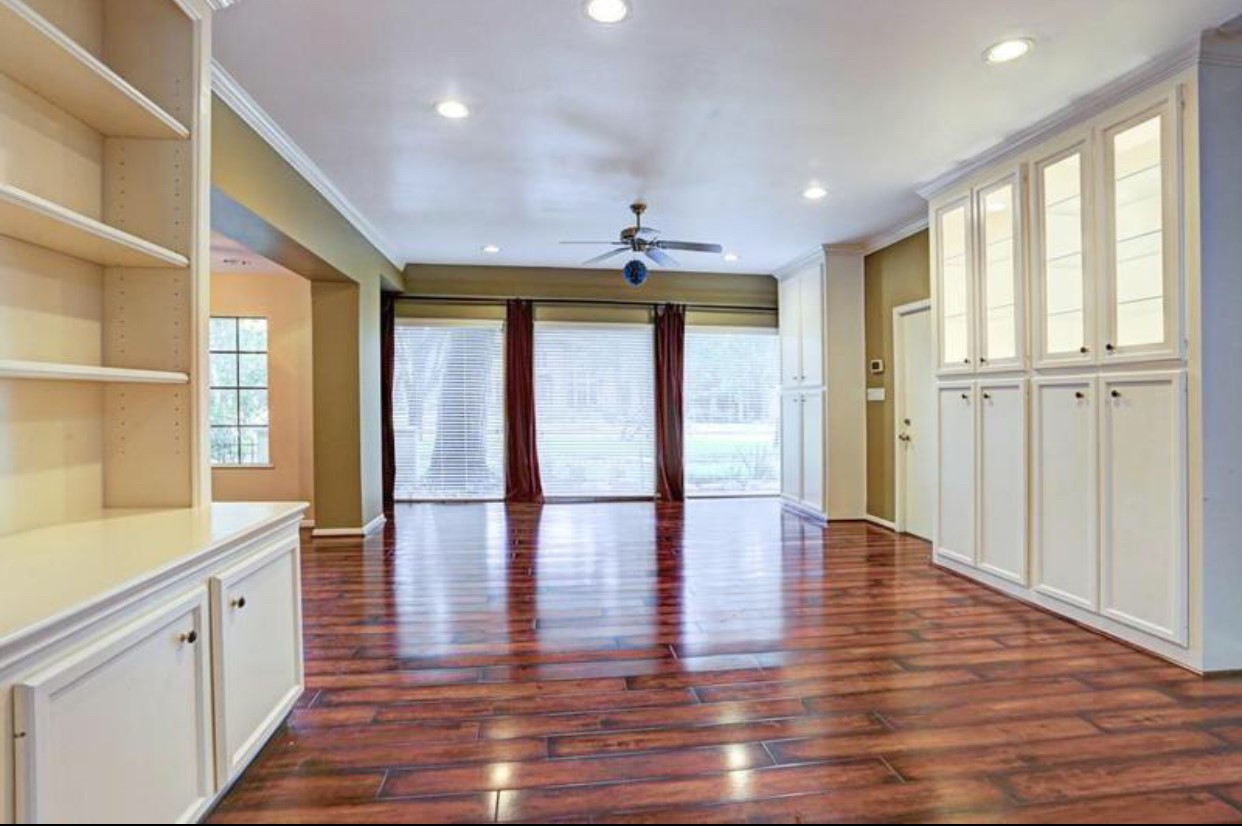 11910 Steppingstone Lane Houston, TX 77024 - Photo 3 of 14 a view of an entryway with wooden floor and windows