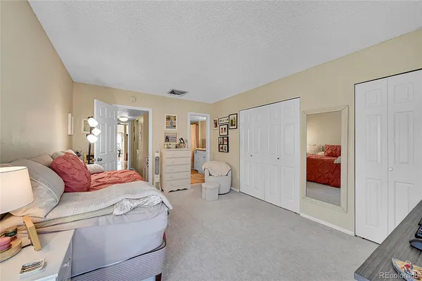 a living room with furniture and white walls
