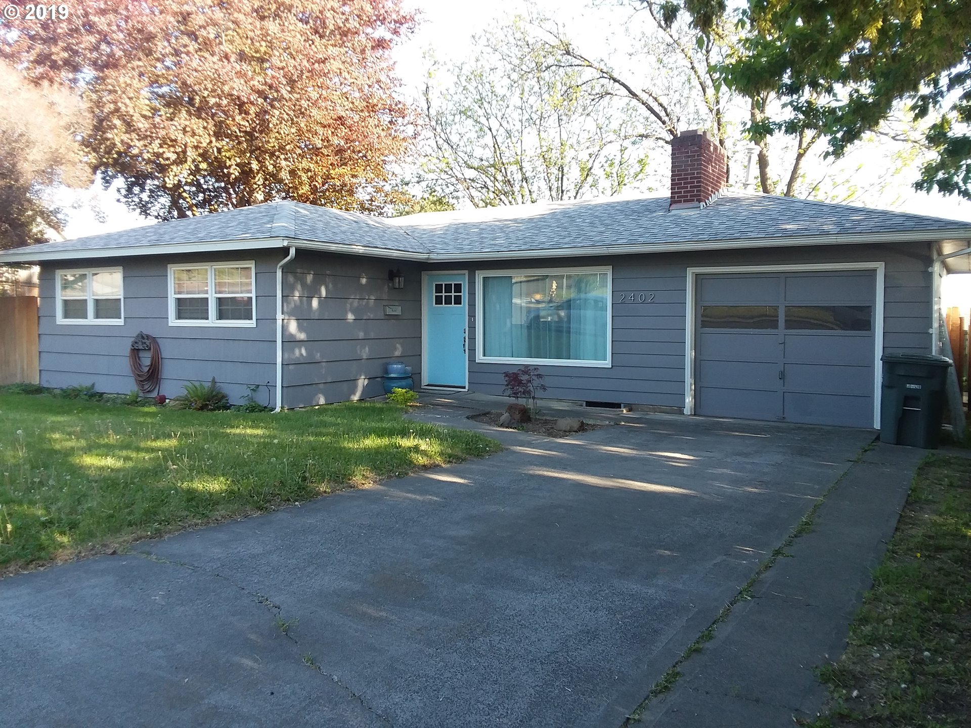 2402 Southwest Olson Avenue Pendleton, OR 97801 - Photo 2 of 26 a front view of a house with a yard and garage