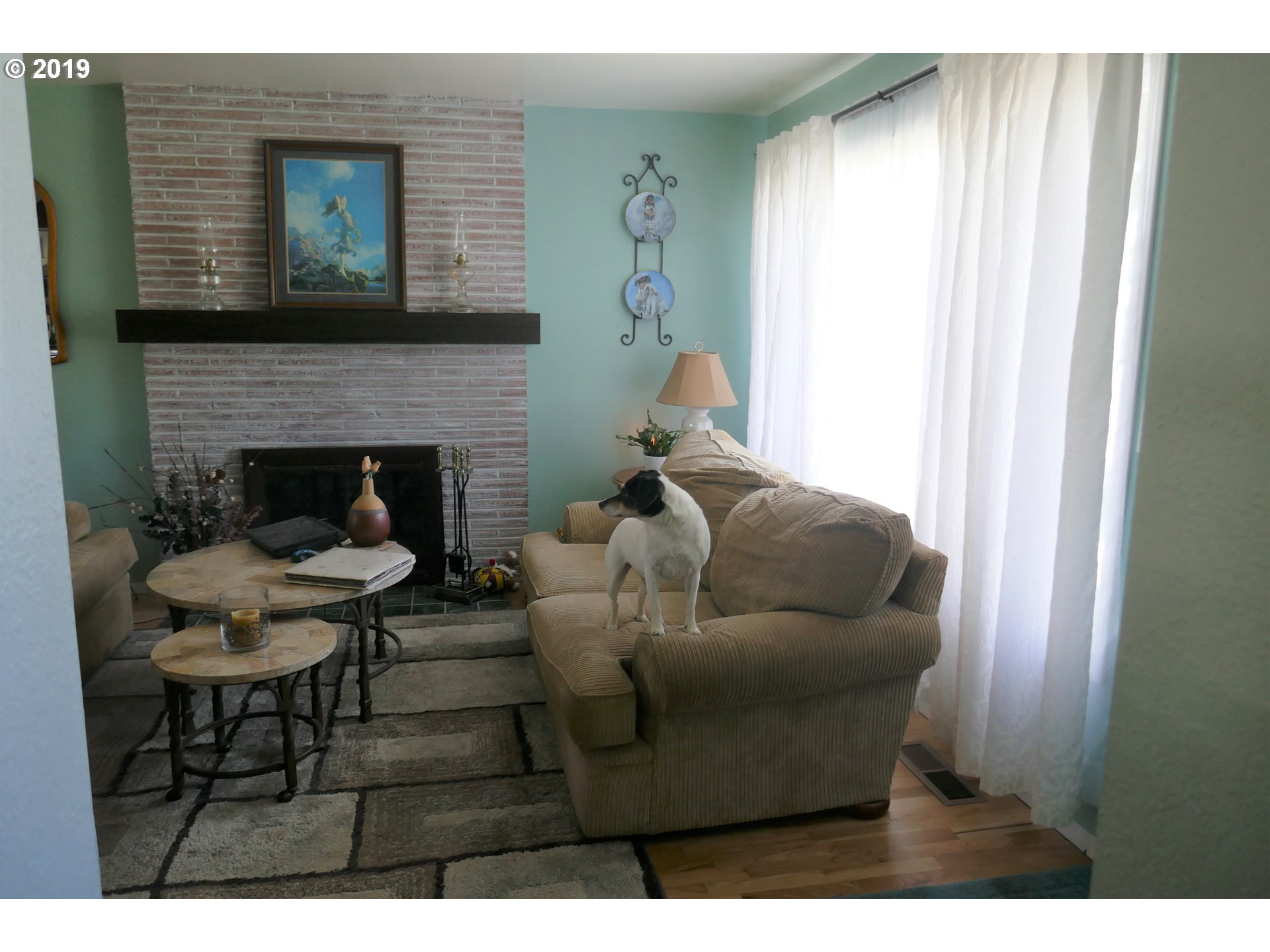 2402 Southwest Olson Avenue Pendleton, OR 97801 - Photo 6 of 26 a living room with furniture and a fireplace