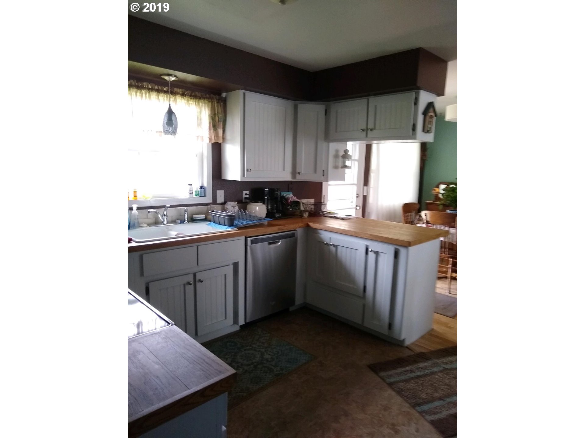 2402 Southwest Olson Avenue Pendleton, OR 97801 - Photo 9 of 26 a kitchen with a sink stove and cabinets