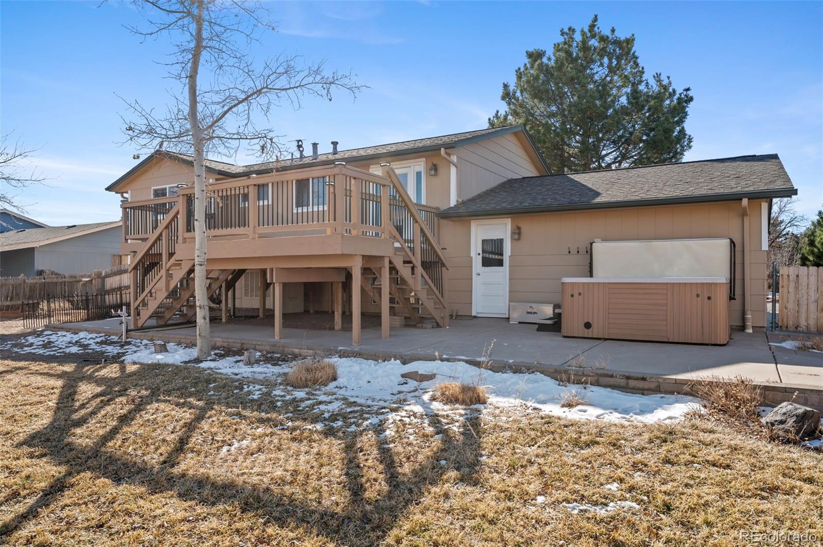 357 Saturn Place Lone Tree, CO 80124 - Photo 23 of 39 a front view of a house with a yard