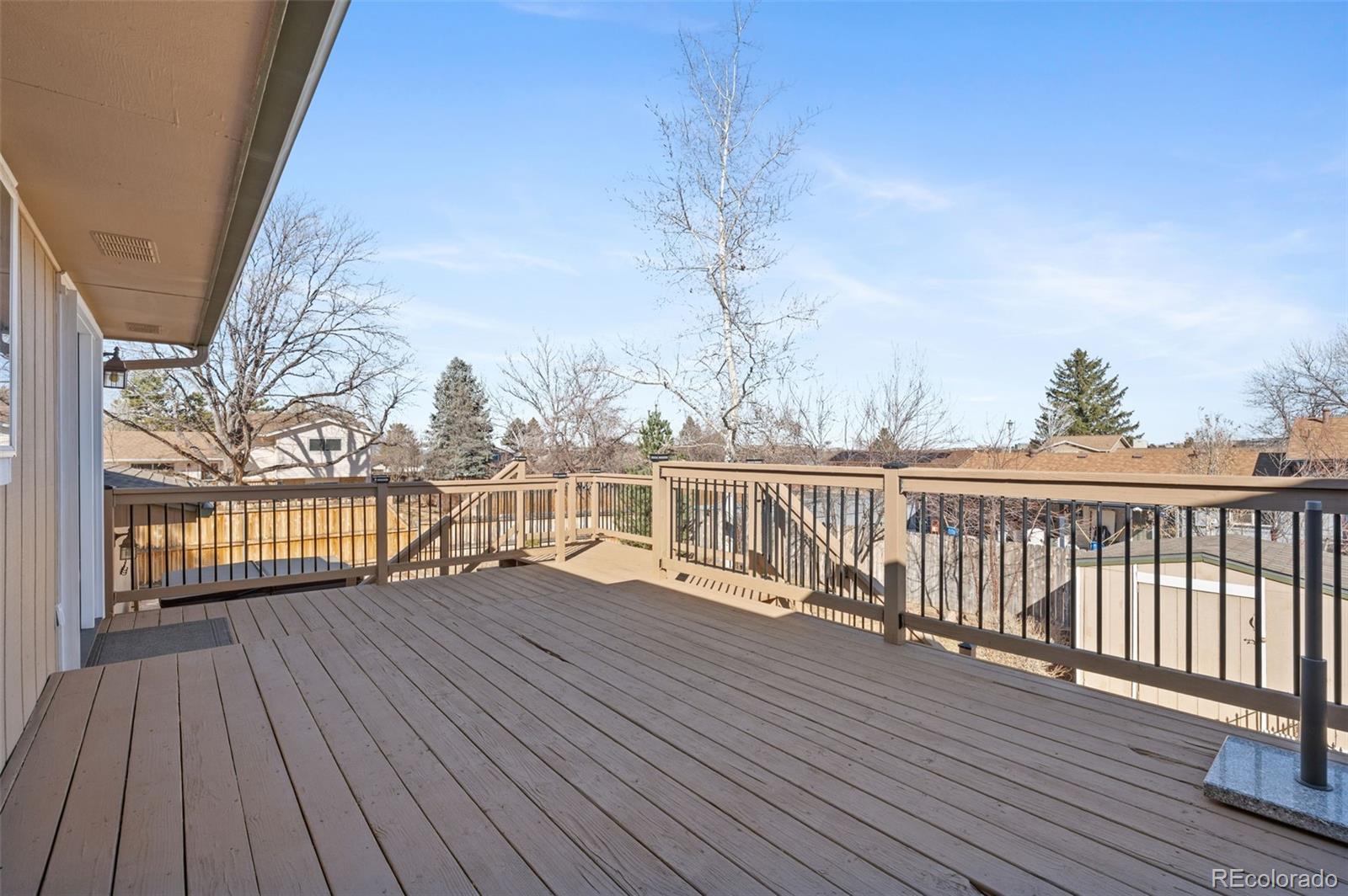 357 Saturn Place Lone Tree, CO 80124 - Photo 25 of 39 a view of deck with wooden floor and fence
