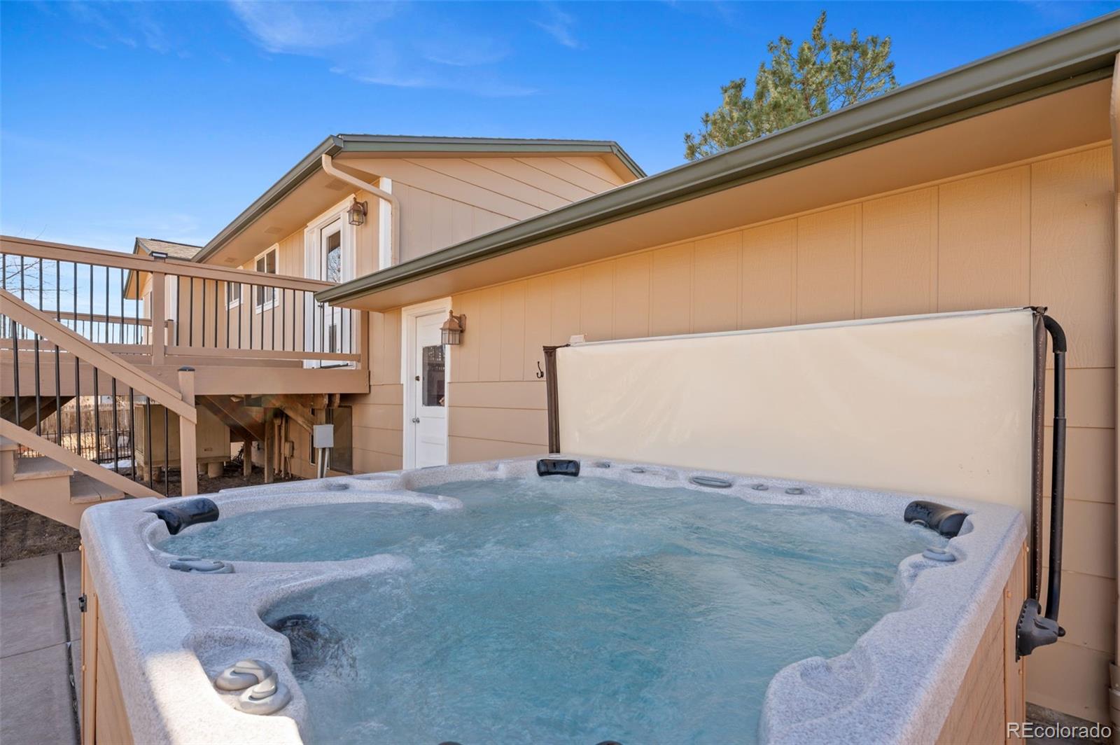 357 Saturn Place Lone Tree, CO 80124 - Photo 29 of 39 a view of a blue house with a street