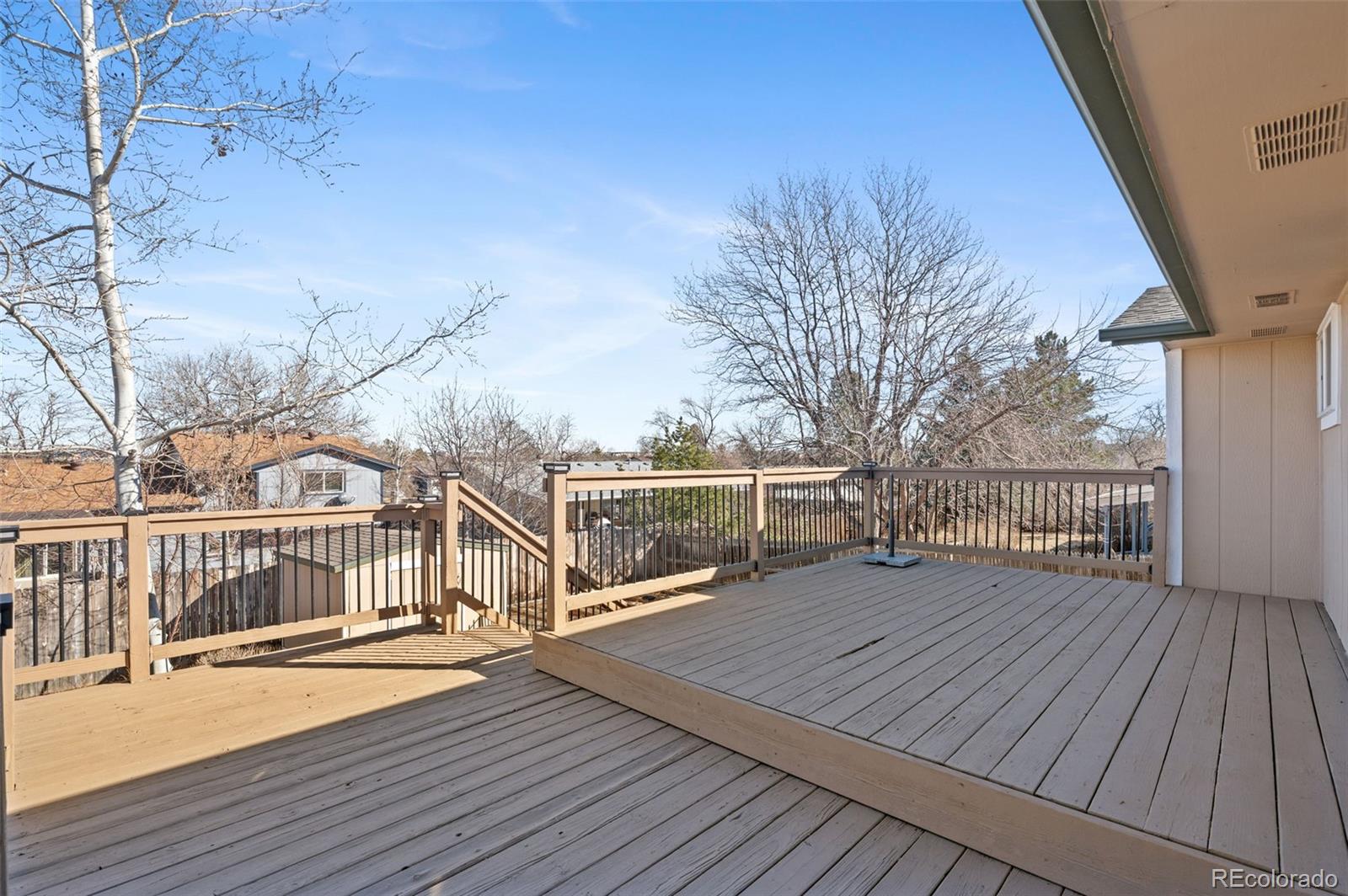 357 Saturn Place Lone Tree, CO 80124 - Photo 9 of 39 a view of a house with wooden deck