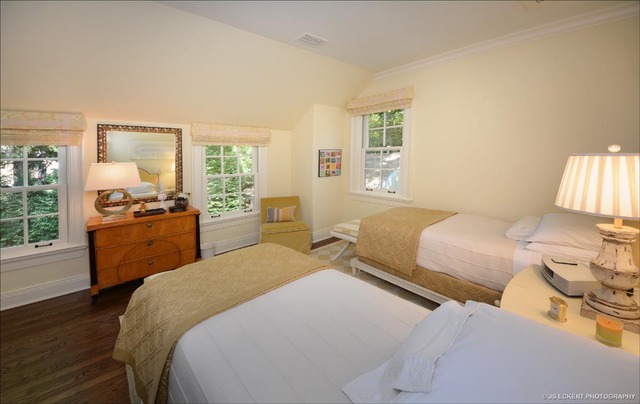 1363 Elm Tree Road Lake Forest, IL 60045 - Photo 17 of 24 a bedroom with a bed and wooden floor