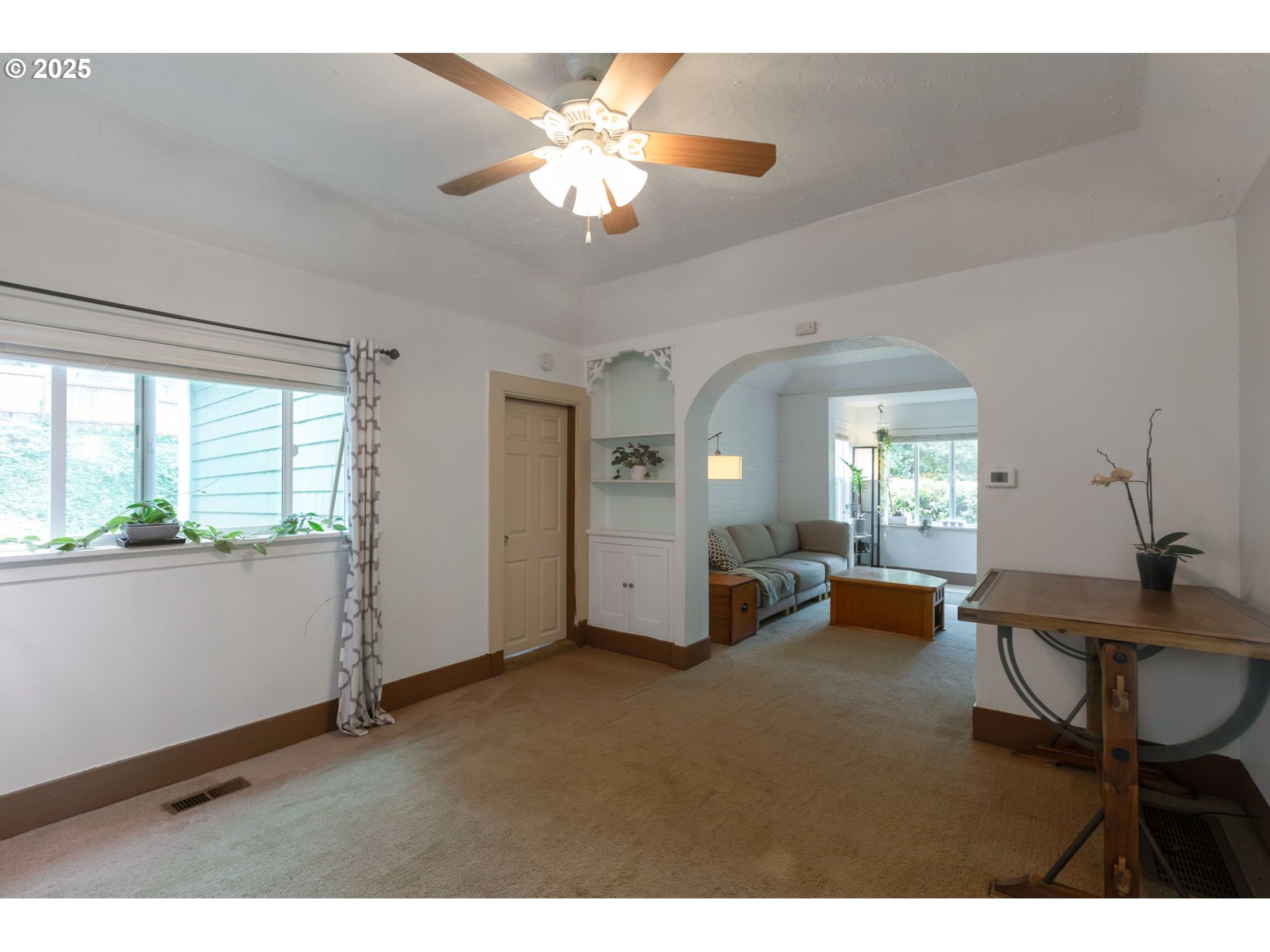 9224 Southwest 26th Avenue Portland, OR 97219 - Photo 13 of 30 a view of a livingroom with furniture window and wooden floor