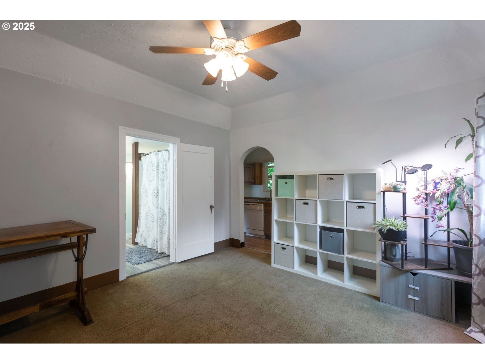 9224 Southwest 26th Avenue Portland, OR 97219 - Photo 17 of 30 a living room with furniture a chandelier and a window