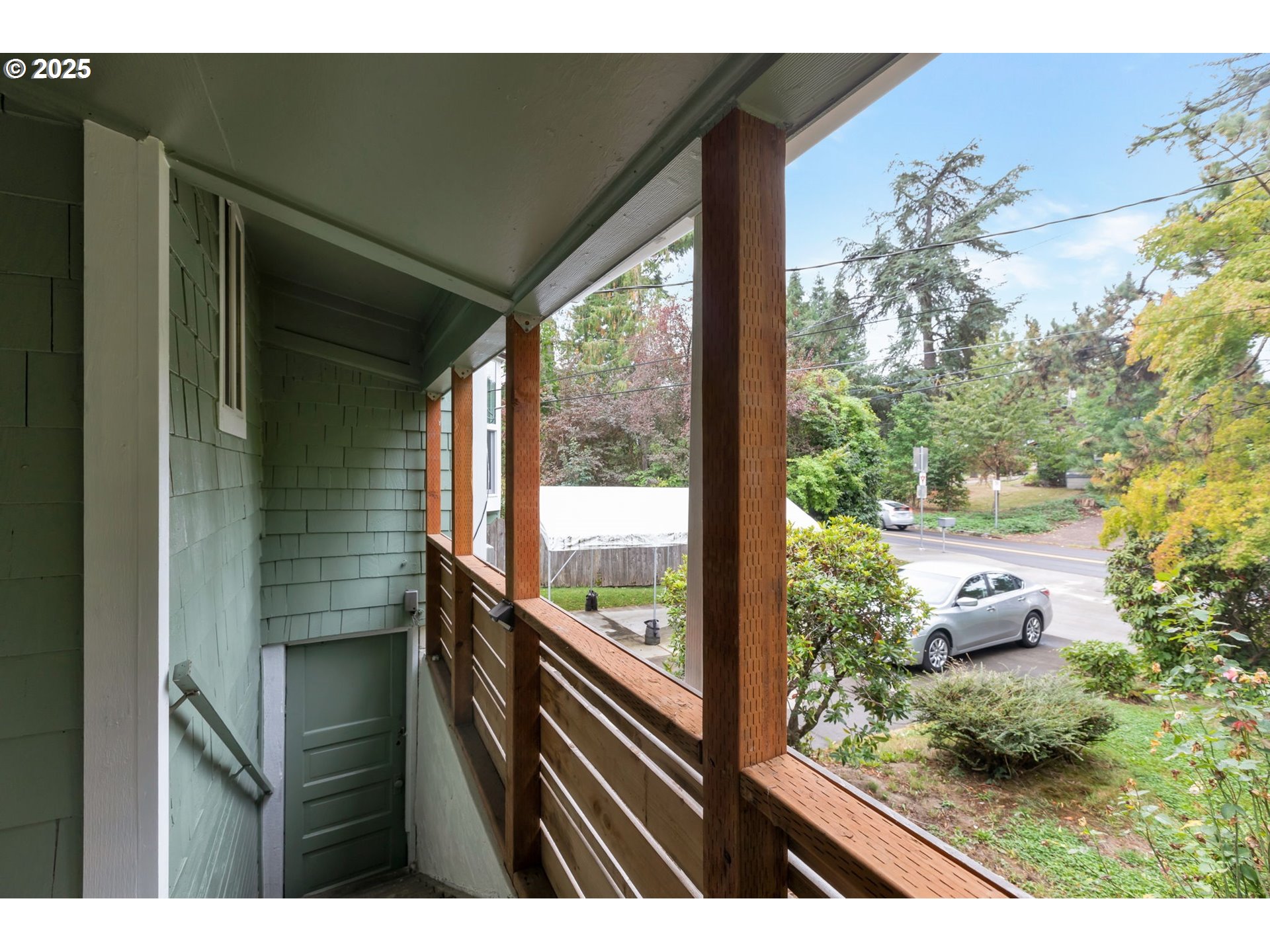 9224 Southwest 26th Avenue Portland, OR 97219 - Photo 21 of 30 a view of a garden from a balcony