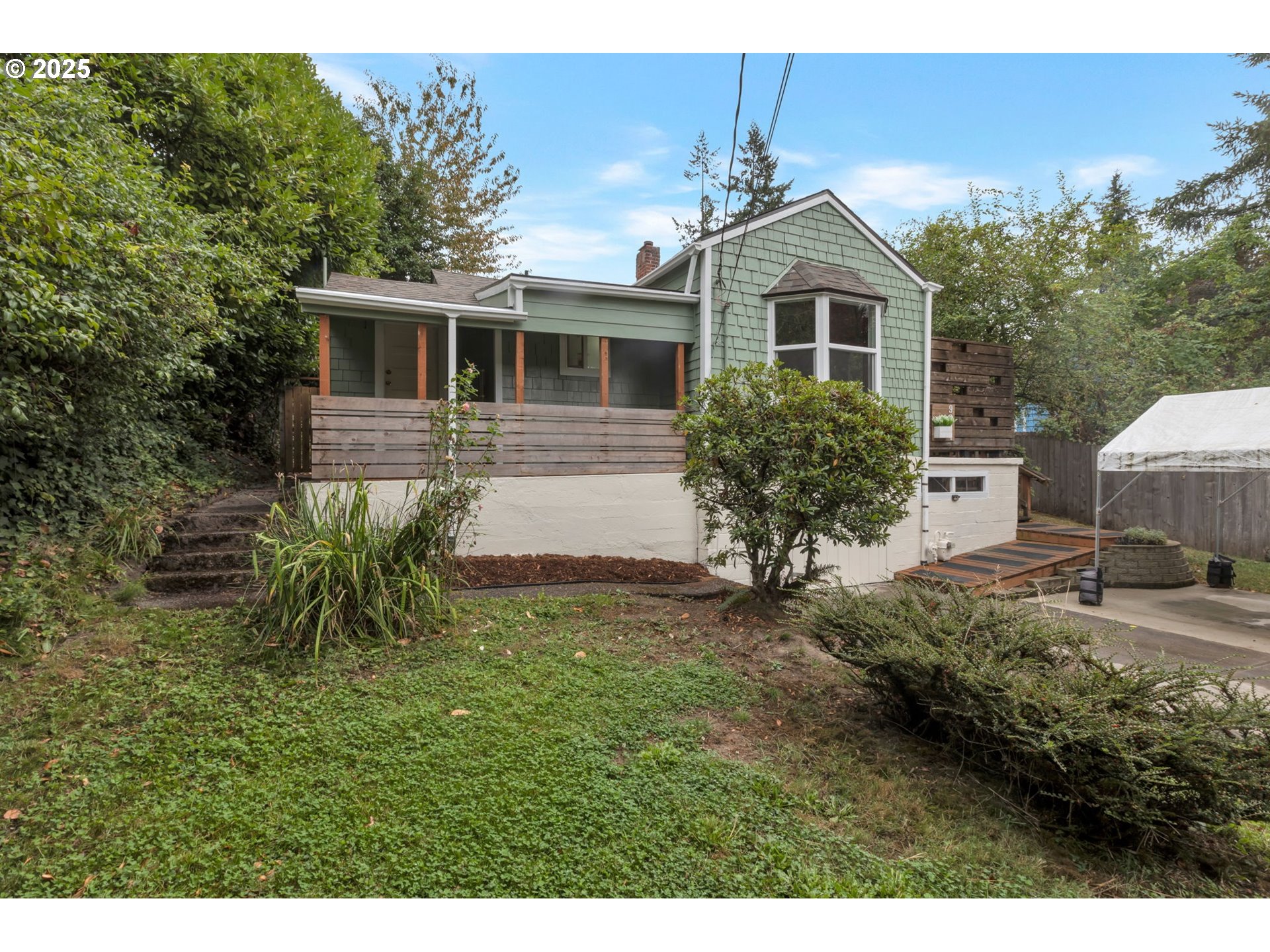 9224 Southwest 26th Avenue Portland, OR 97219 - Photo 23 of 30 a front view of a house with garden