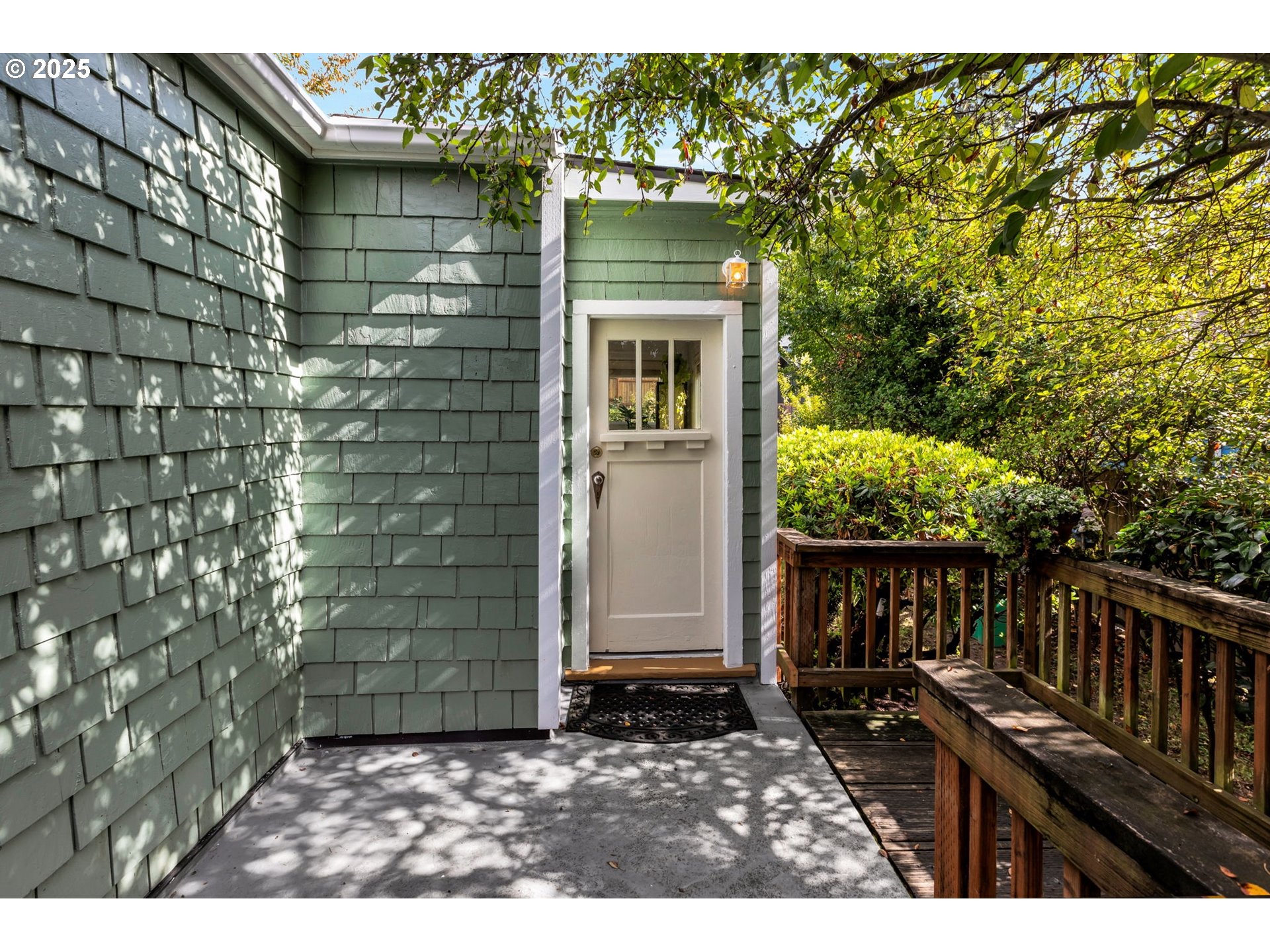 9224 Southwest 26th Avenue Portland, OR 97219 - Photo 3 of 30 a backyard of a house with lots of green space