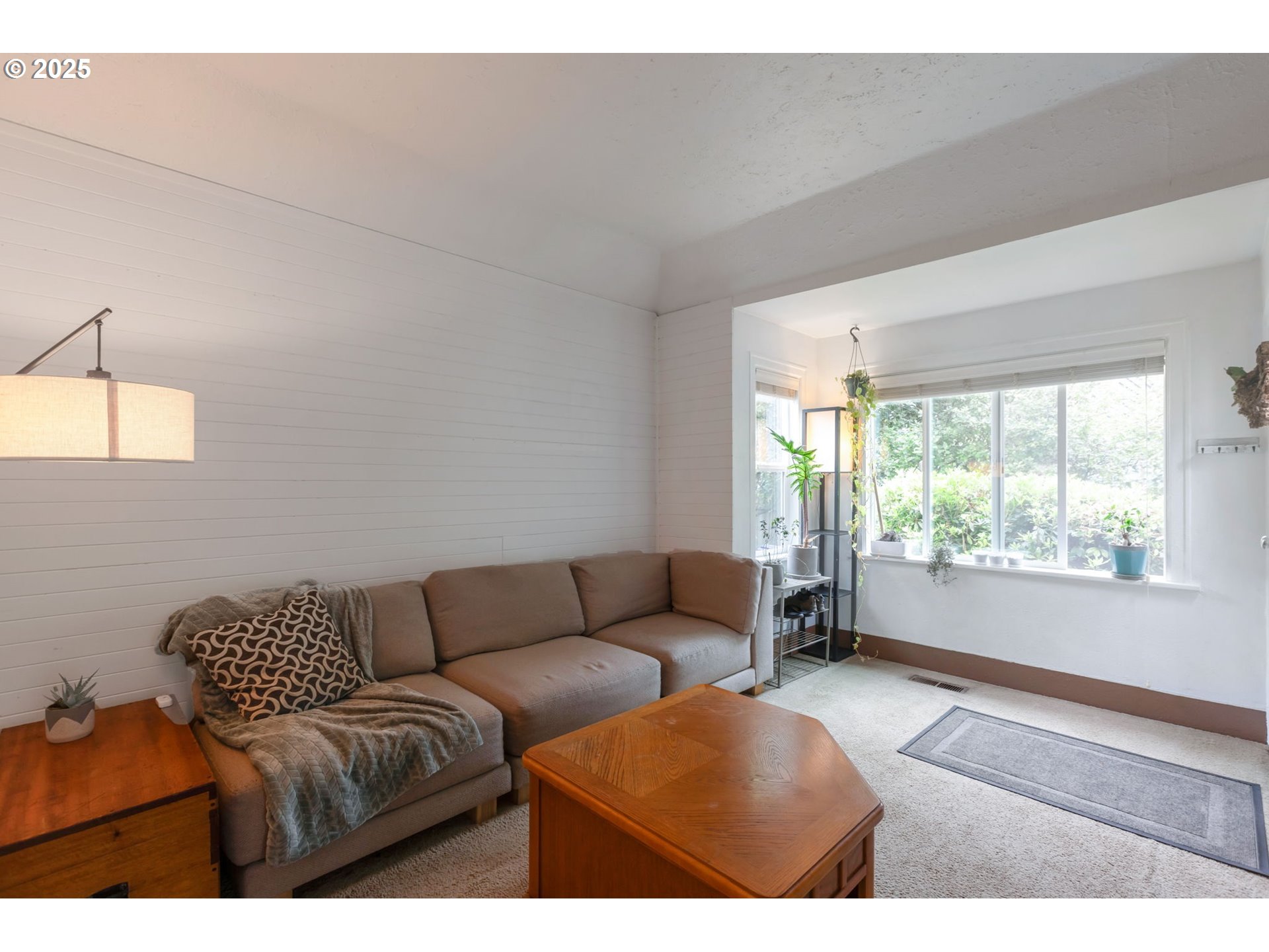 9224 Southwest 26th Avenue Portland, OR 97219 - Photo 5 of 30 a living room with furniture and a window