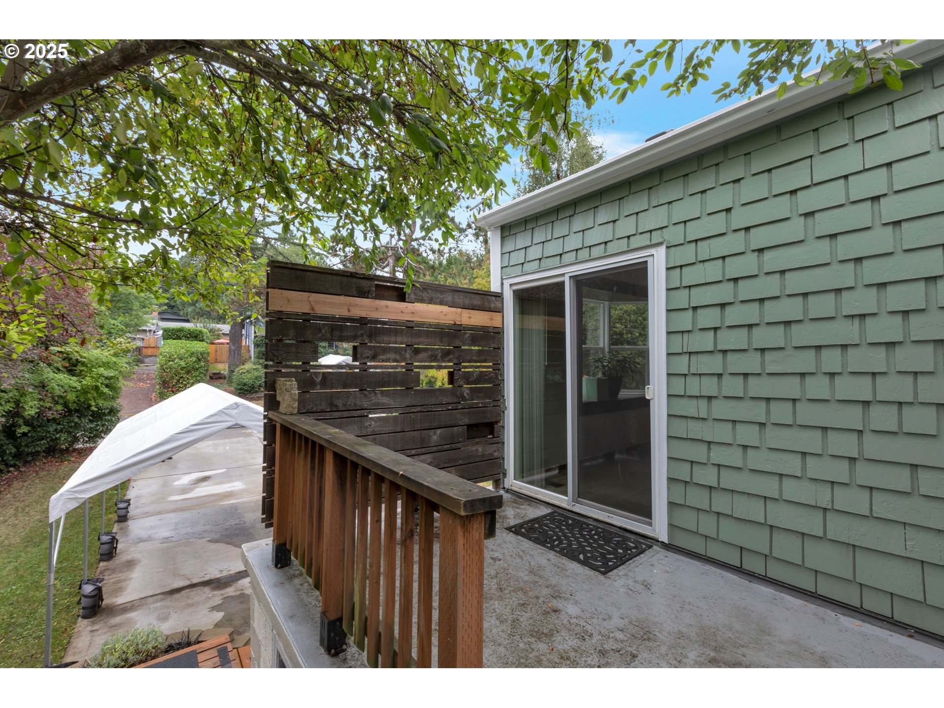 9224 Southwest 26th Avenue Portland, OR 97219 - Photo 10 of 30 a backyard of a house with lots of green space