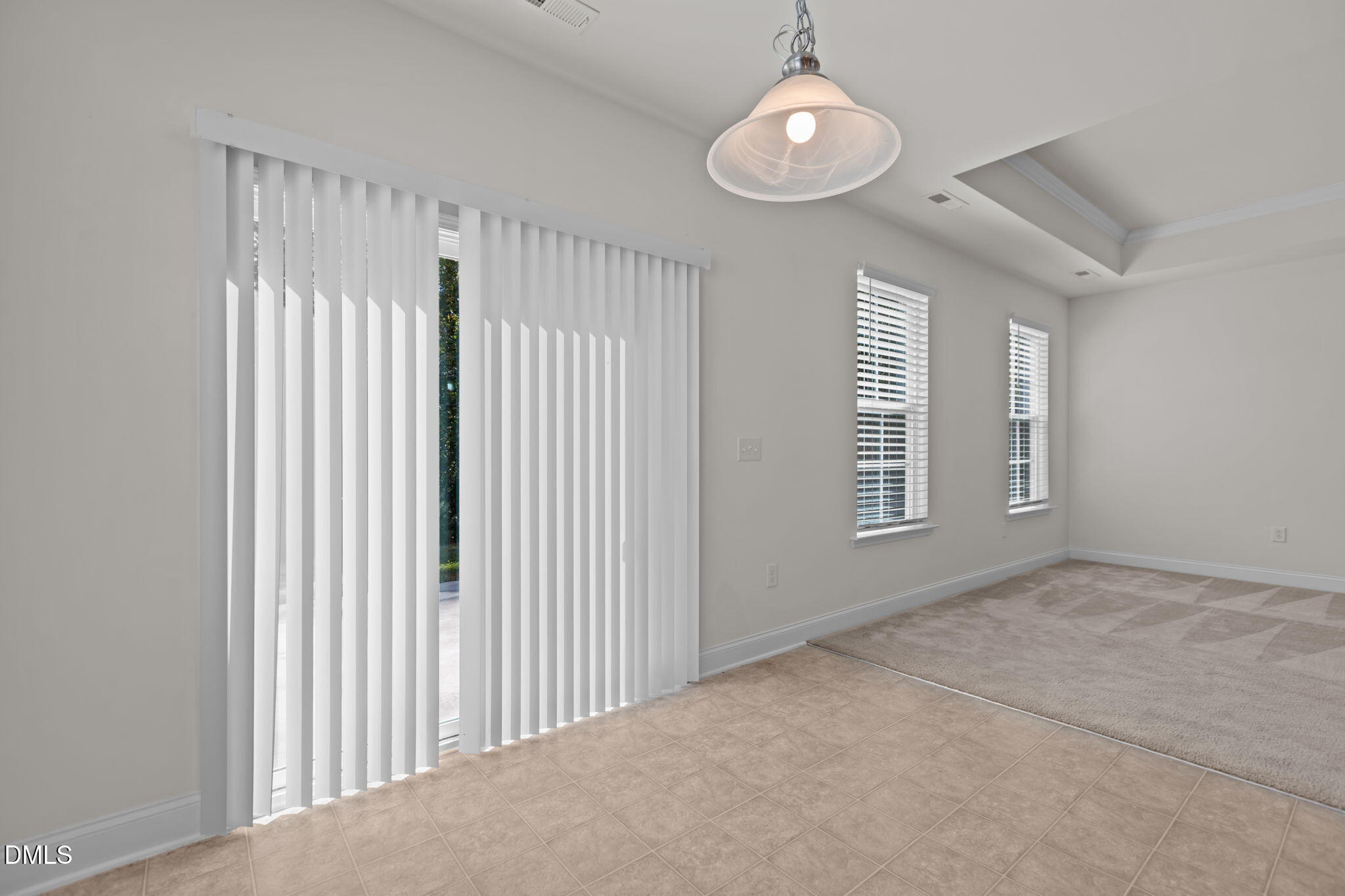 354 Dando Street Garner, NC 27529 - Photo 15 of 61 en empty room with windows and ceiling fan