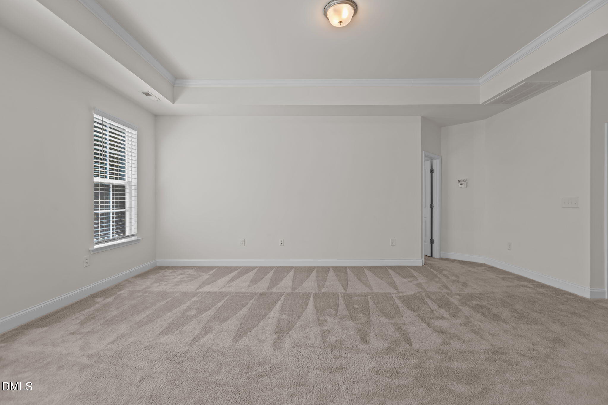 354 Dando Street Garner, NC 27529 - Photo 16 of 61 a view of an empty room with a window