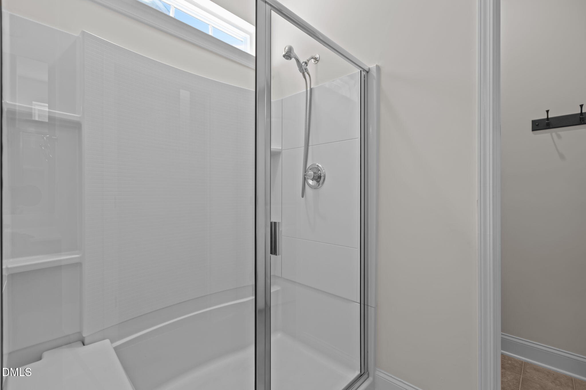 354 Dando Street Garner, NC 27529 - Photo 23 of 61 a bathroom with a shower and a glass door